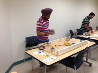 Individuals working on electrical projects