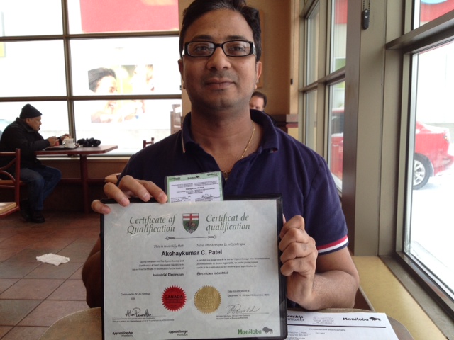 Worker displaying a certificate