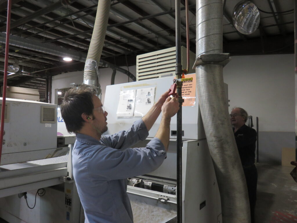 Worker installing electrical equipment
