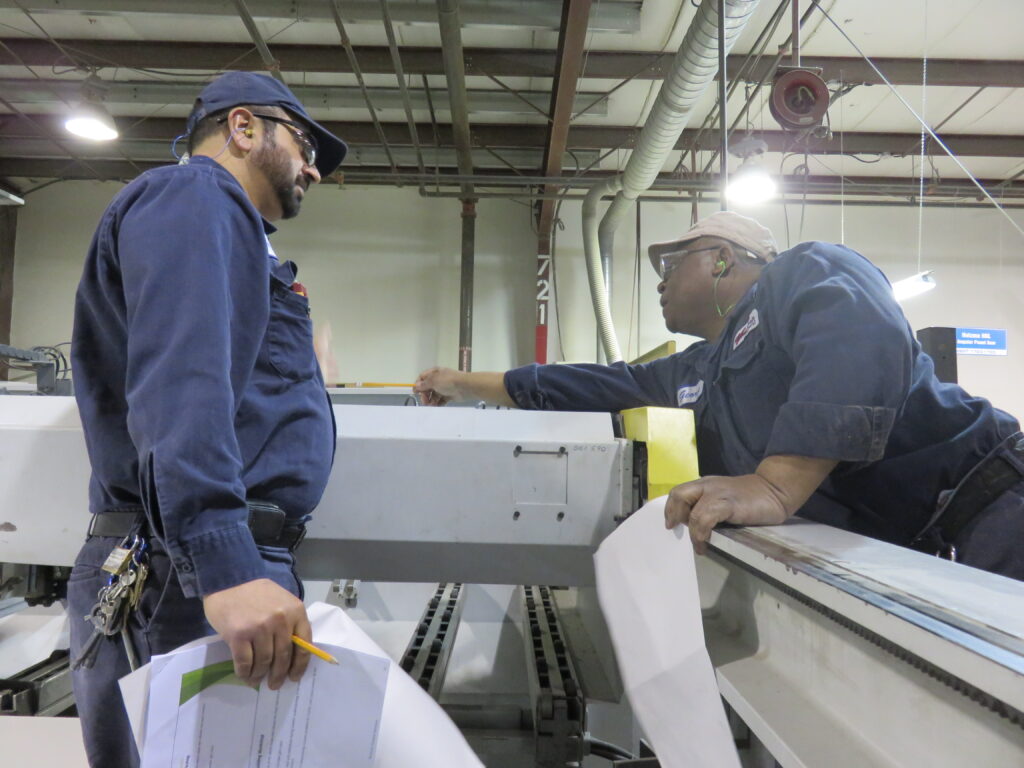 Technicians inspecting equipment